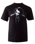 The Dark Knight dark Joker graphic on a black adult t-shirt.