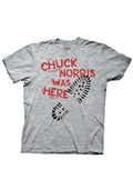 Chuck Norris "Norris was here" joke graphic on a heathered grey adult t-shirt.