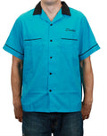 Dexter bowl bleed graphic on a blue adult shirt.