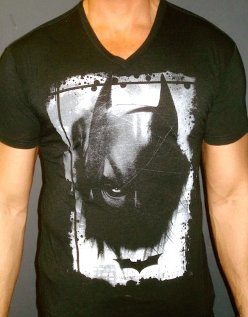 Batman The Dark Knight Rises knight eye graphic on a black adult t-shirt.