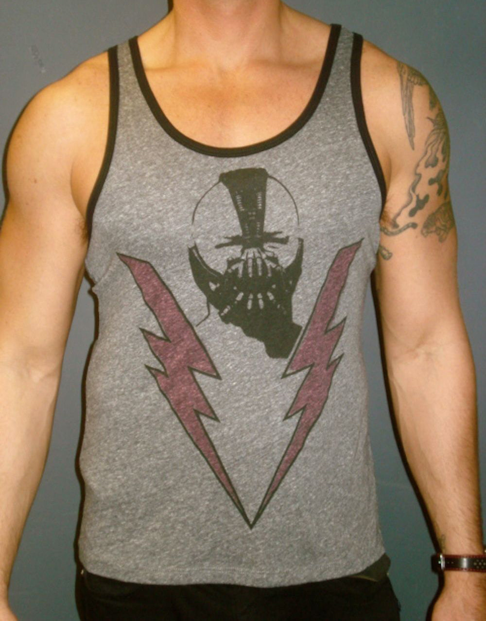 Bane The Dark Knight Rises lighting graphic on a dark grey heathered adult ringer tank top.