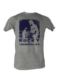 Rocky v Thunderlips graphic on a heathered light grey adult t-shirt.