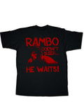 Rambo he waits graphic on a black adult t-shirt.