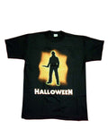 Halloween Michael Myers shape graphic on a black adult t-shirt.